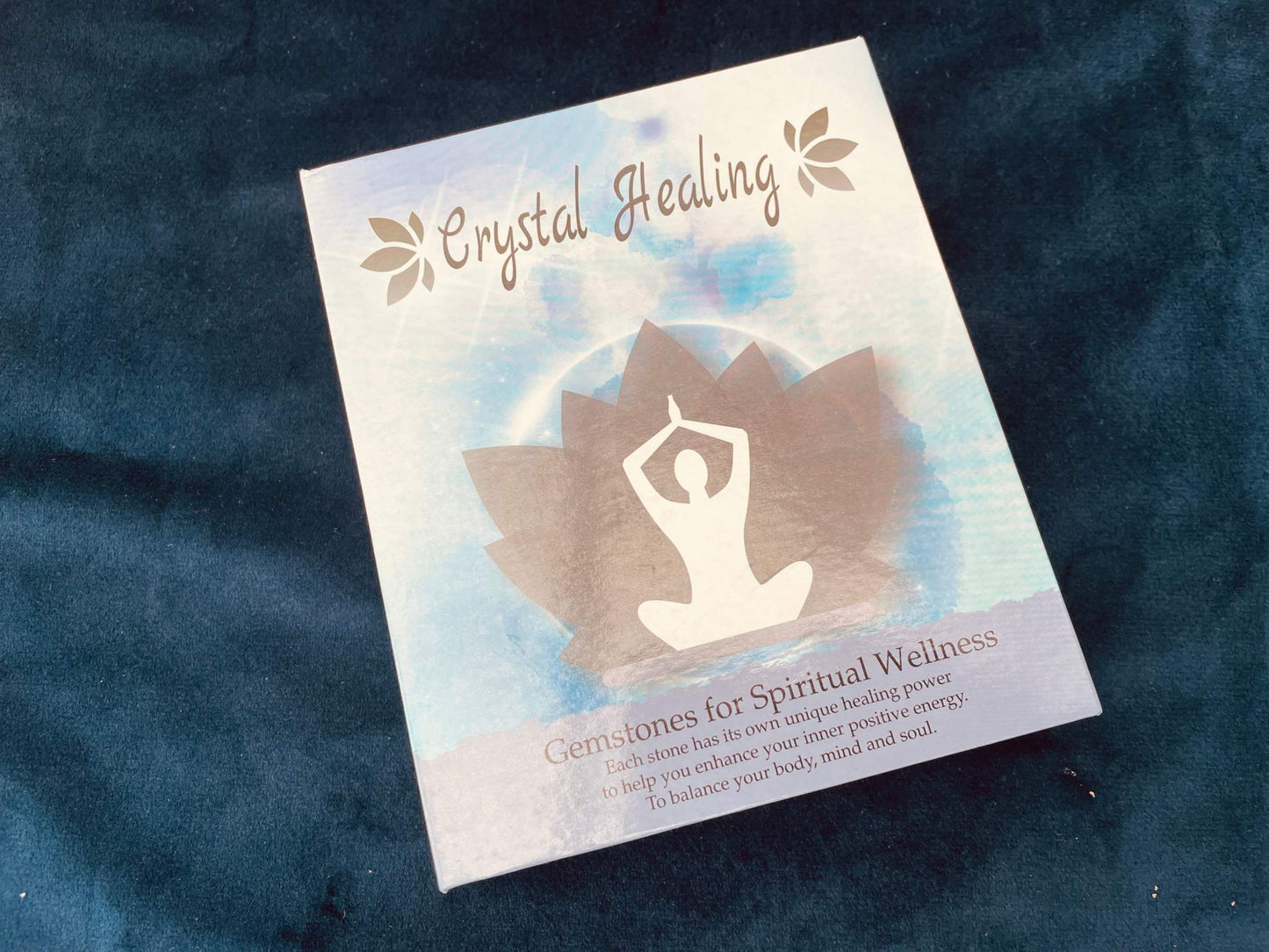 Crystal Healing Gemstone Set packaging on dark velvet background.