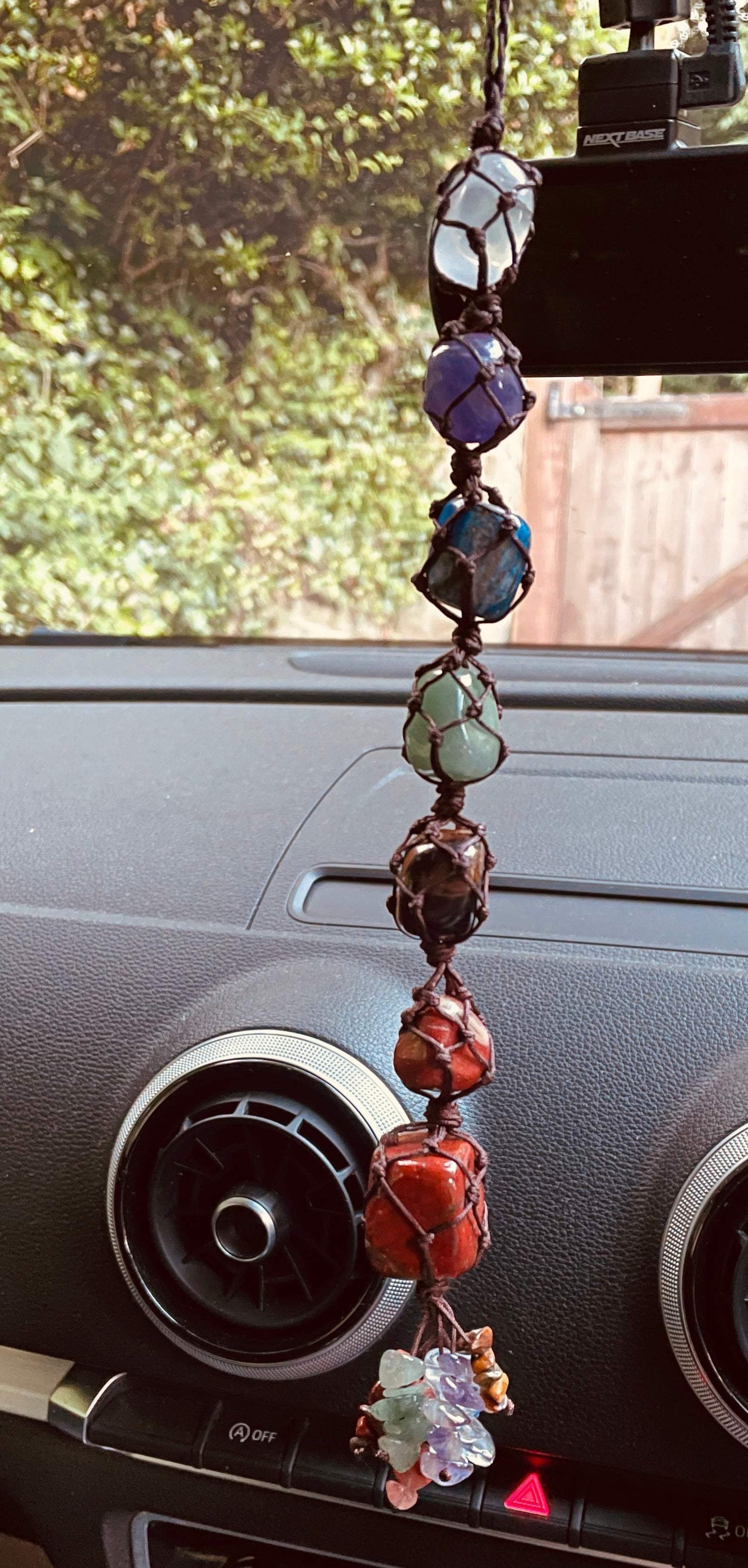 Handmade 7 Chakra Healing Crystal Window Car Decor hanging inside a vehicle.