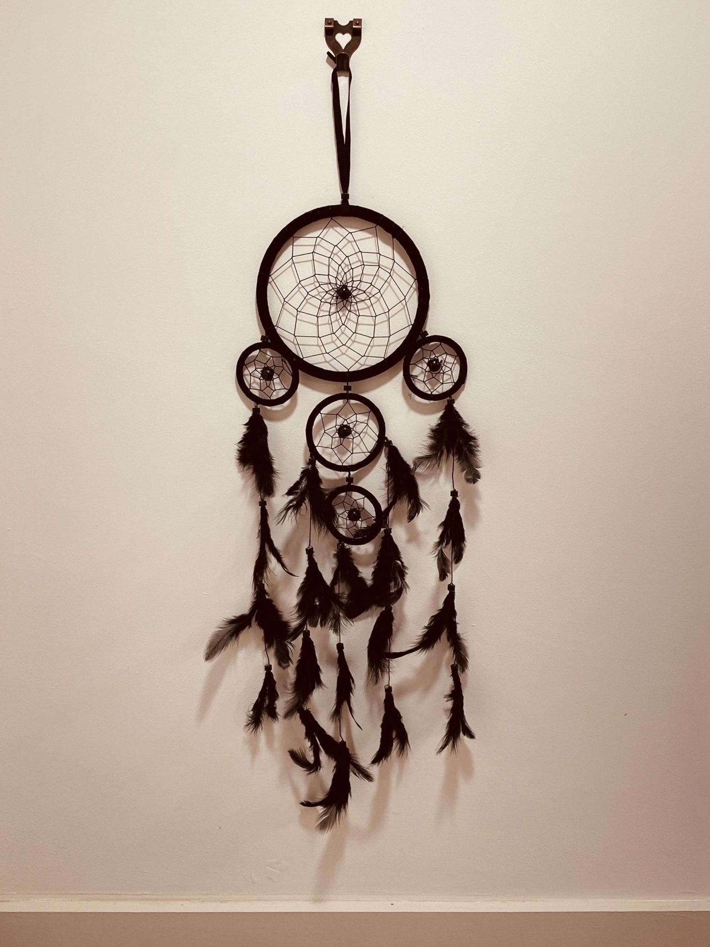 Indian style multi-ring Dreamcatcher with intricate design and multiple rings, handcrafted for home decor and spiritual use.