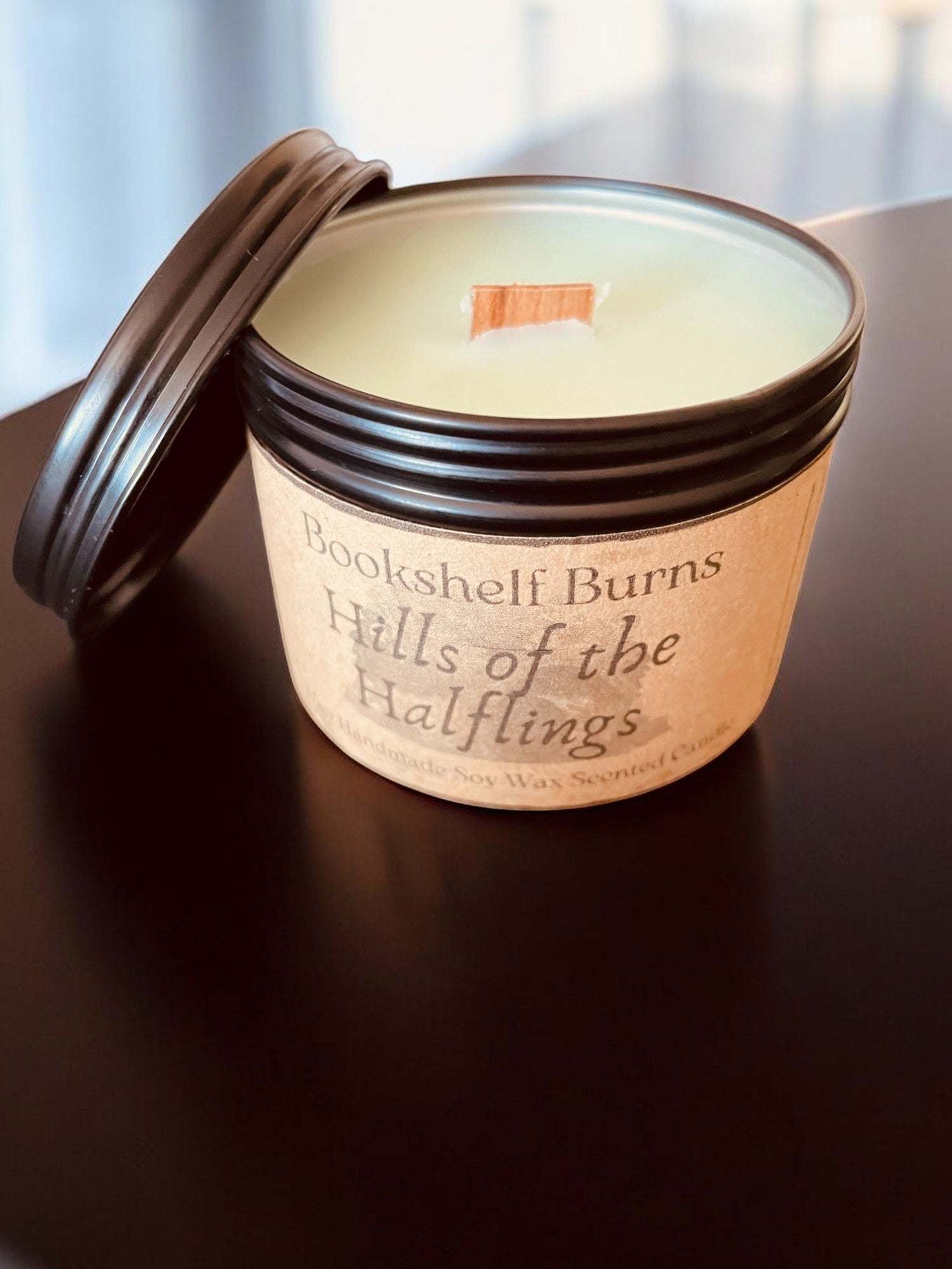 Hand poured scented candle in tin, inspired by classic literary tales.