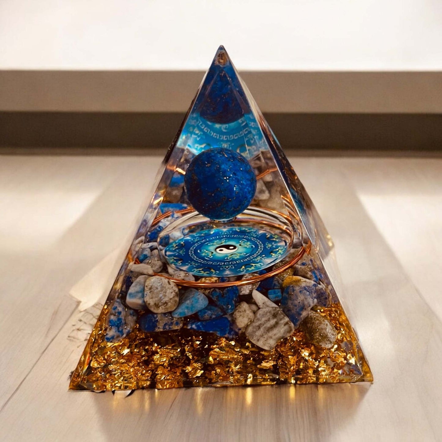 Orgonite Pyramid enhancing energy and harmony in a modern interior setting.