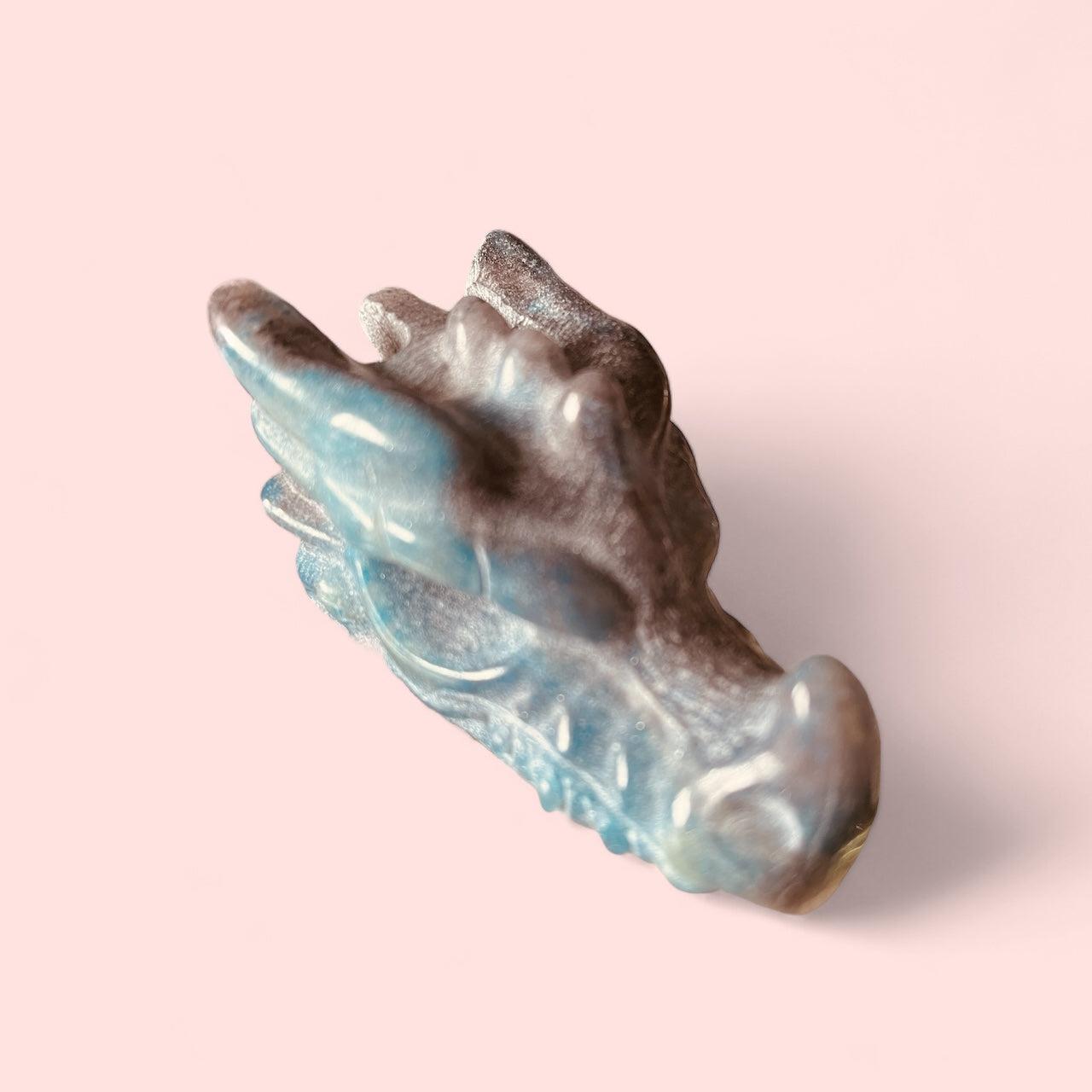 Carved gemstone dragon head in labradorite, 60mm long and 32mm tall.