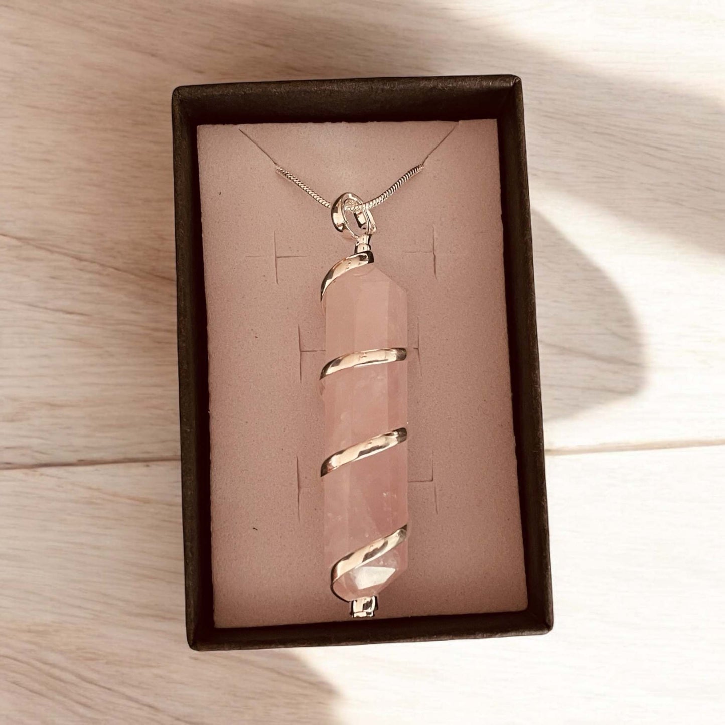 Rose Quartz Pendant with silver-plated cage in gift box.