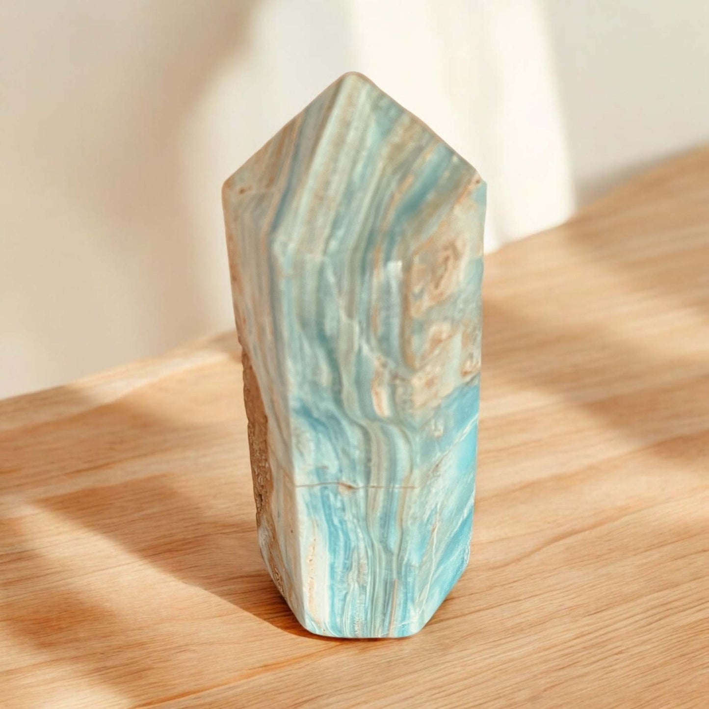 Blue Aragonite Point crystal with calming blue tones, ideal for meditation and home decor.